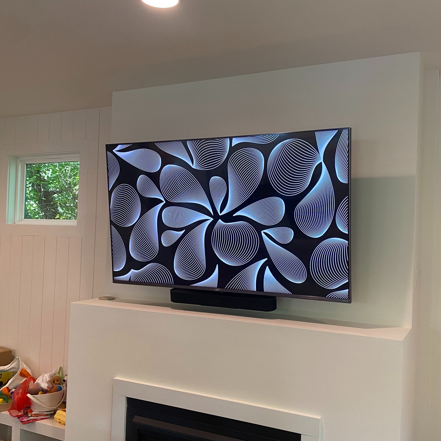 TV above a fireplace completed by Ensysta Build